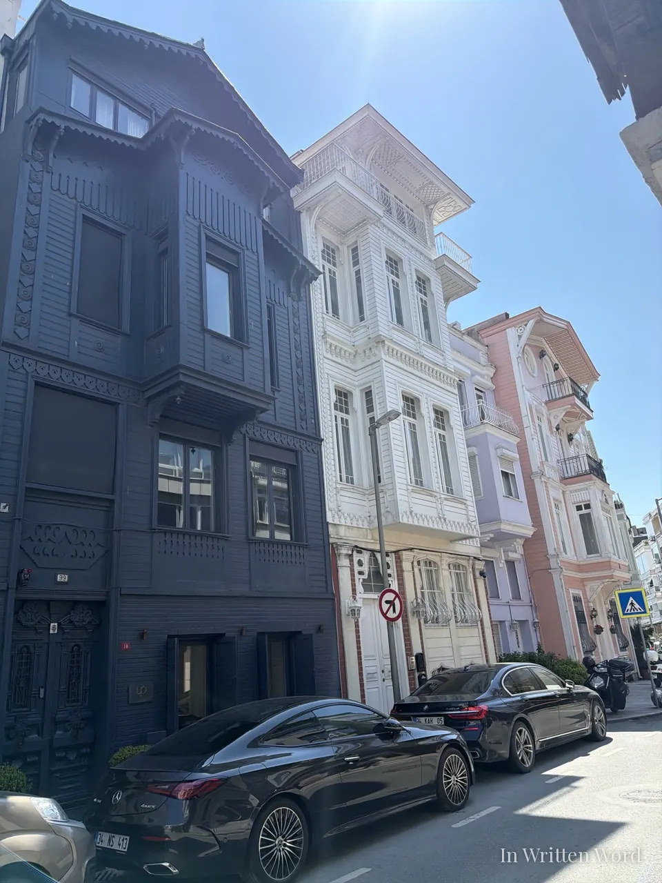 Ornate Ottoman wooden yalı mansions in pink, white, and rose painted facades lining the Bosphorus waterfront in Bebek, Istanbul