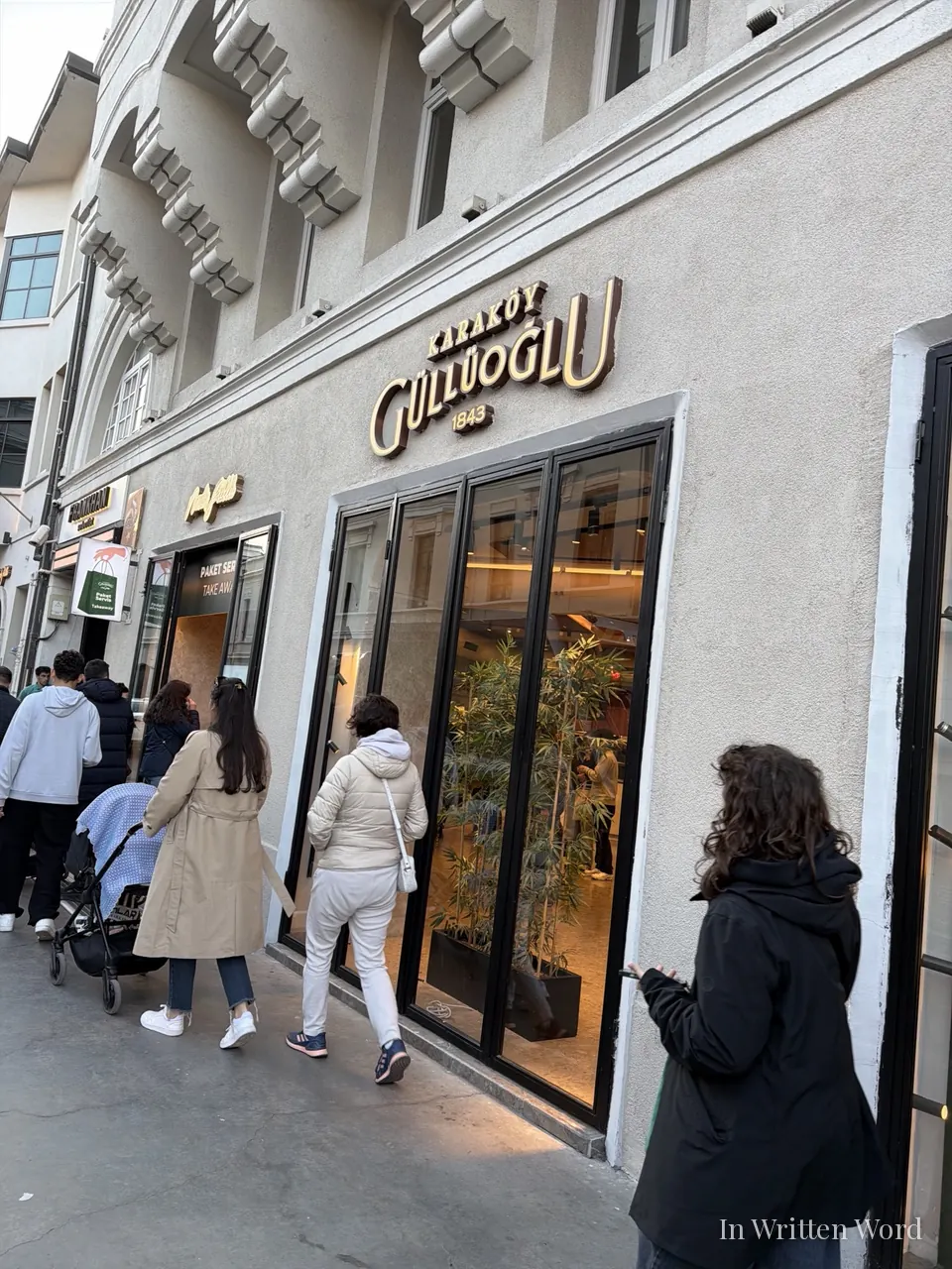 People queuing outside Karaköy Güllüoğlu baklava shop in Istanbul, a legendary pastry institution founded in 1843